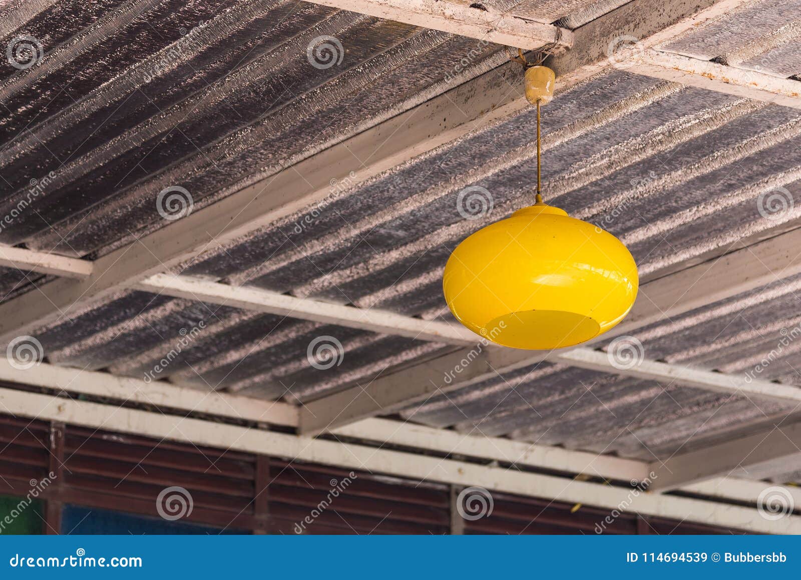 Yellow Glass Lamp Railing On Top Of The Building With A Ceiling