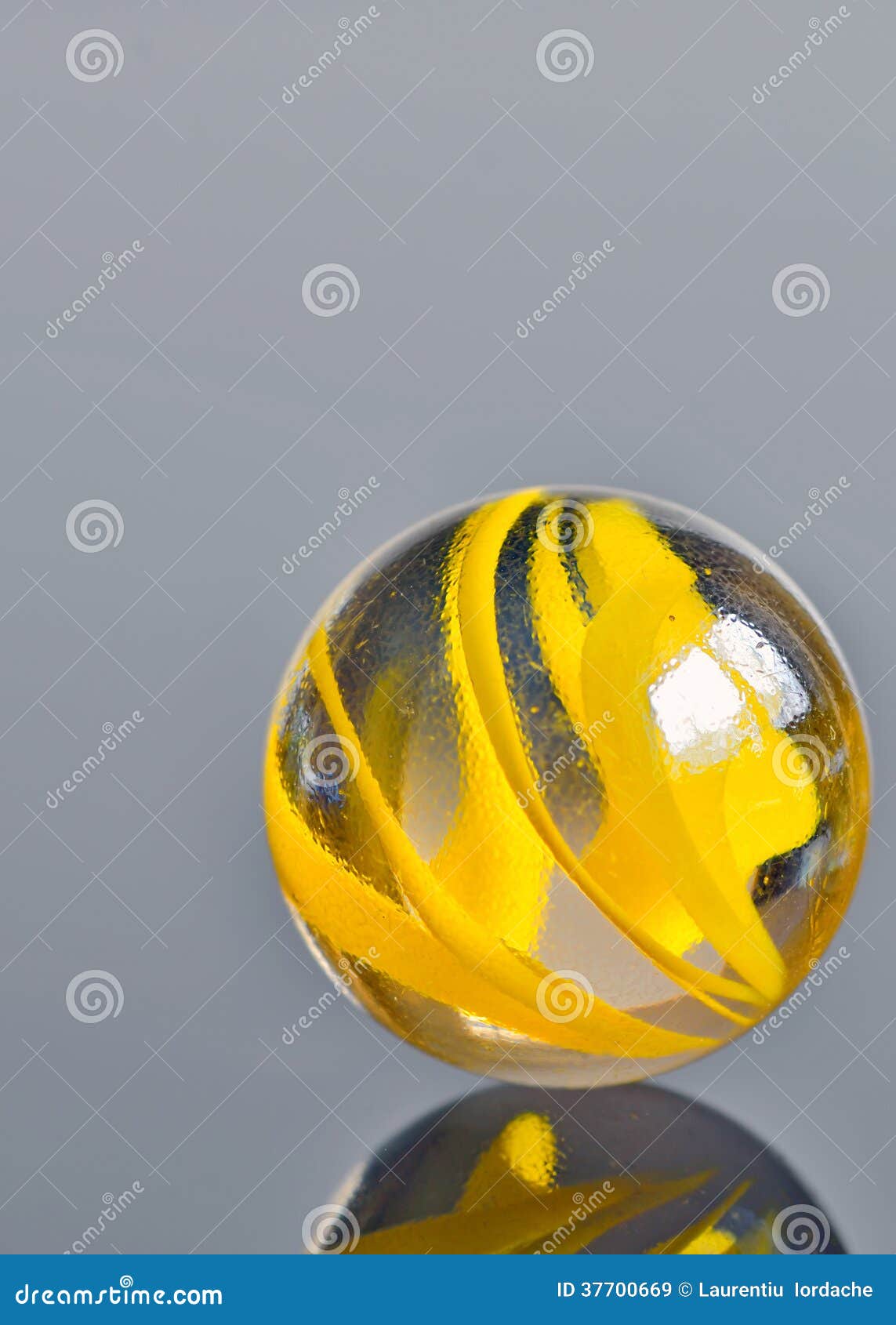 Yellow glass marble stock image. Image of clarity, shiny 37700669