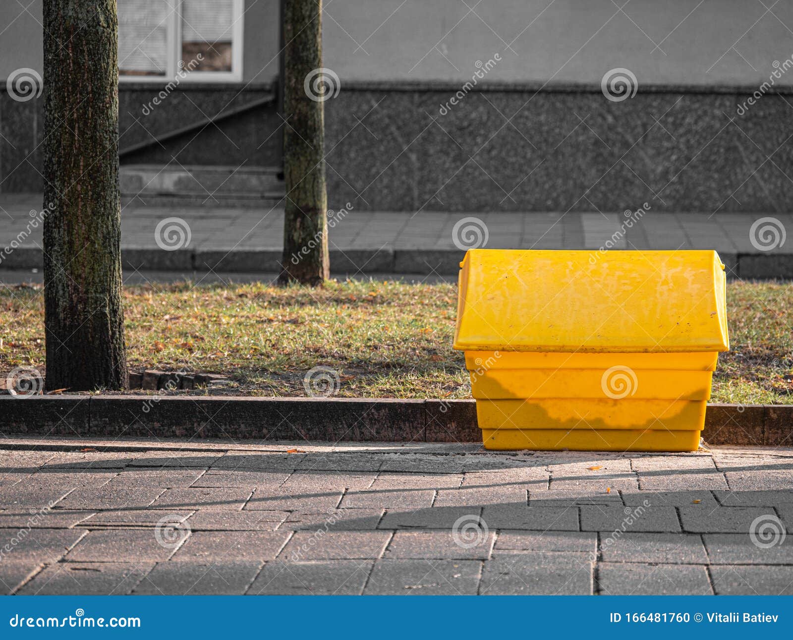 A Yellow Grit Salt Box on the Street. Stock Photo Image of conditions