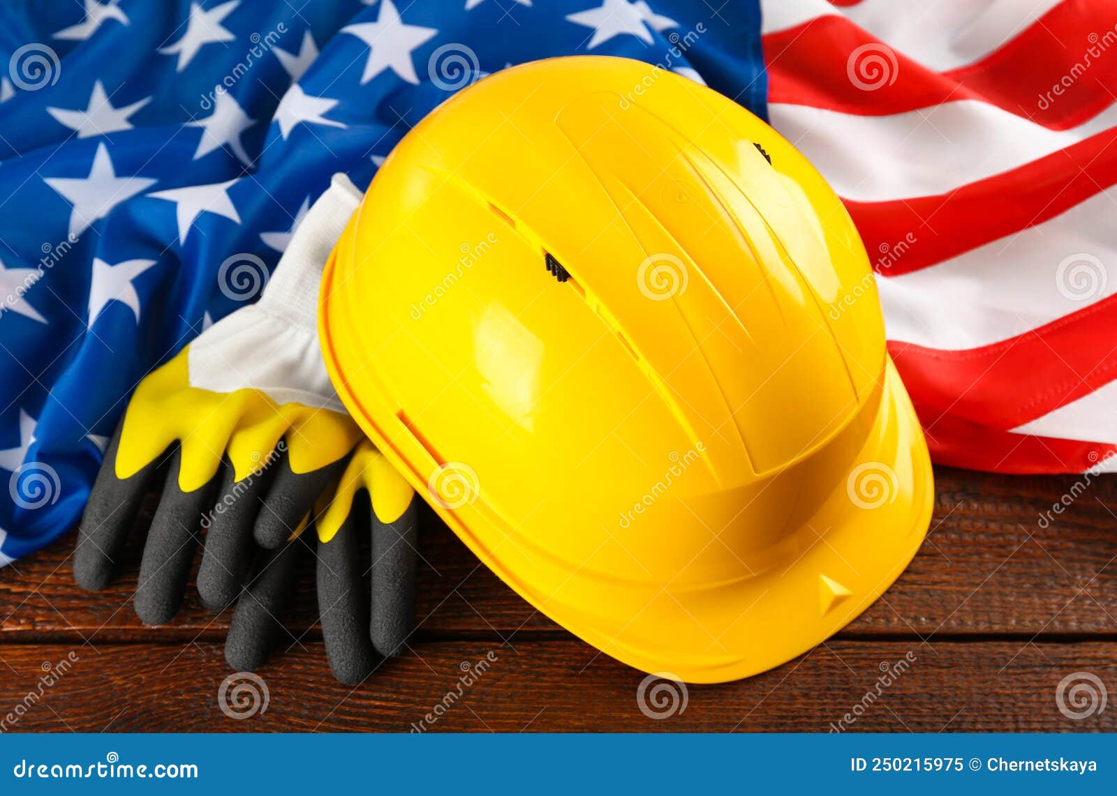 Yellow Hard Hat, Gloves and American Flag on Wooden Table Stock Image ...