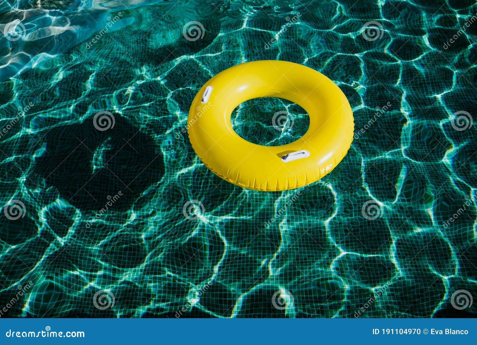 Yellow Inflatable Donuts Floating in a Swimming Pool. Nobody Stock ...