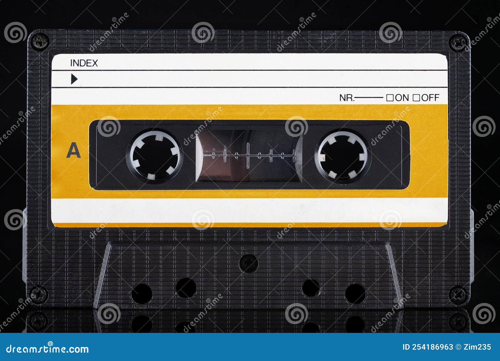 Yellow Labeled Retro Vintage Compact Cassette a Side on Black Stock