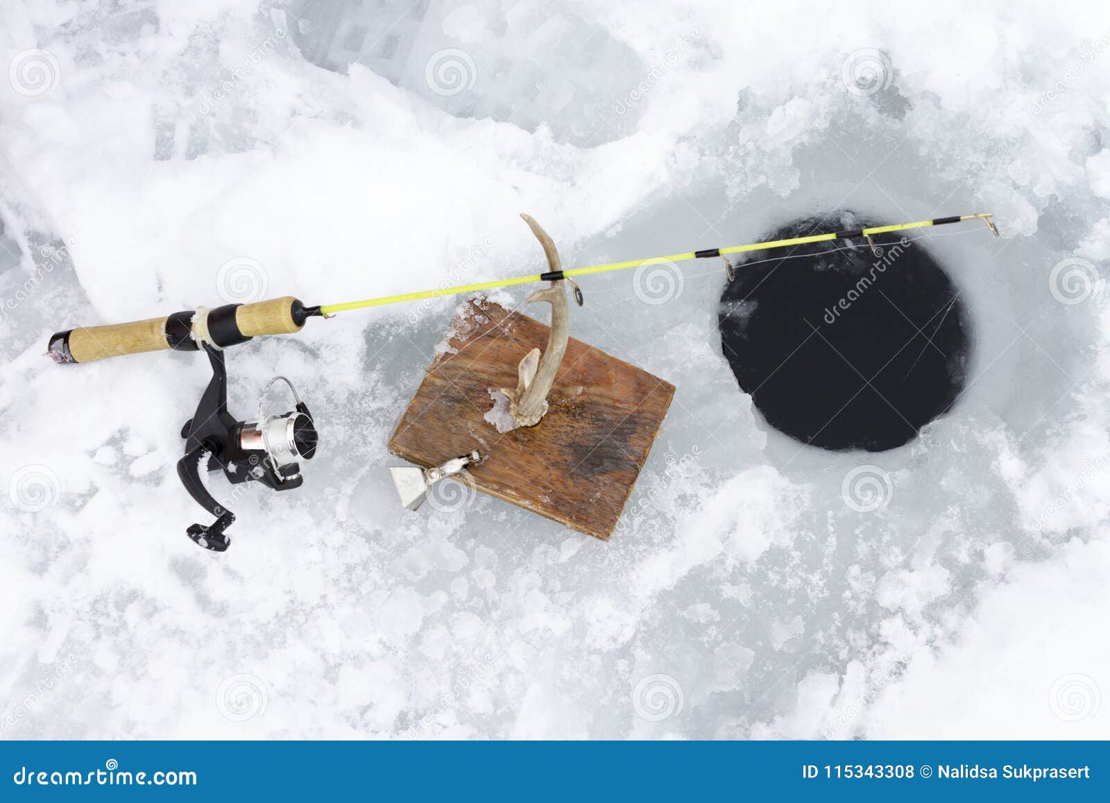 Adult Man Ice Fishing on Yellow Lake Stock Photo - Image of