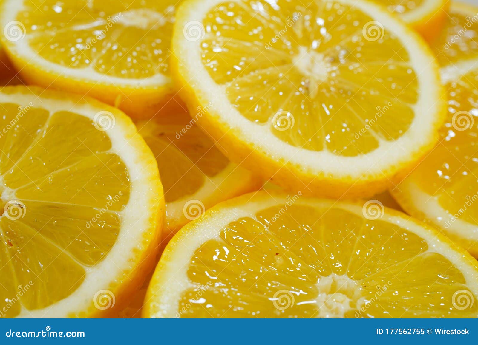 yellow lemons on a plate on a sunny day