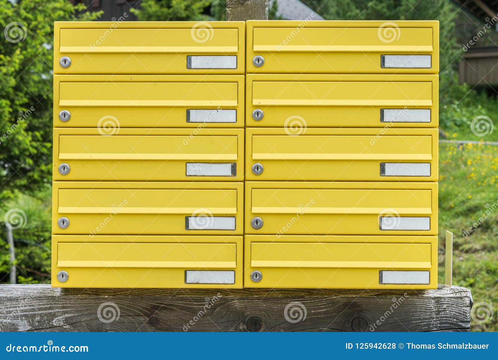 yellow letterbox made of tin without name in a rural area, austria