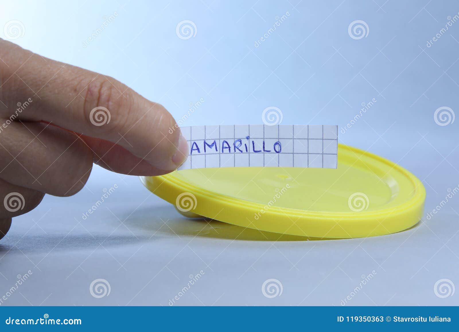yellow lid with small blank note. amarillo the spanish word for yellow