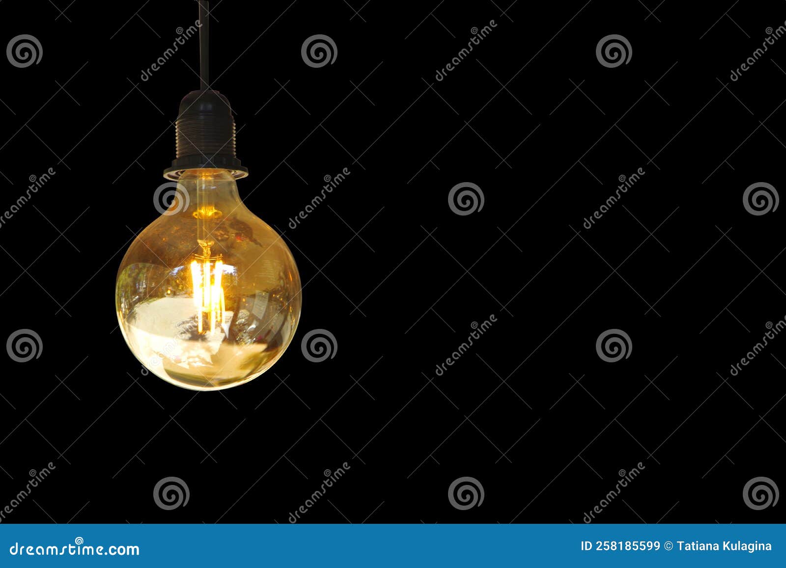 Yellow Light Bulb Isolated on Black Background. Stock Image - Image of