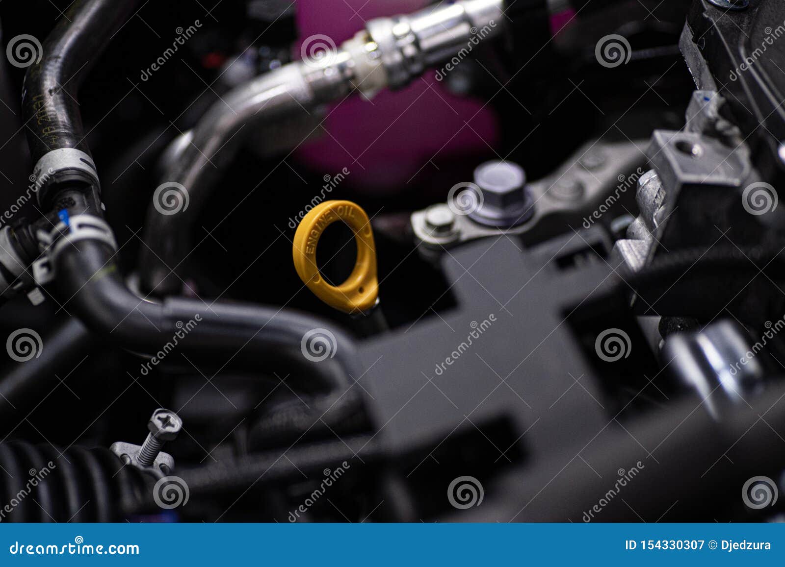 Yellow Oil Dipstick In Car Engine Measuring Level Of Engine Oil Yellow Oil Dipstick In Car Engine Measuring Level Of Engine Oil