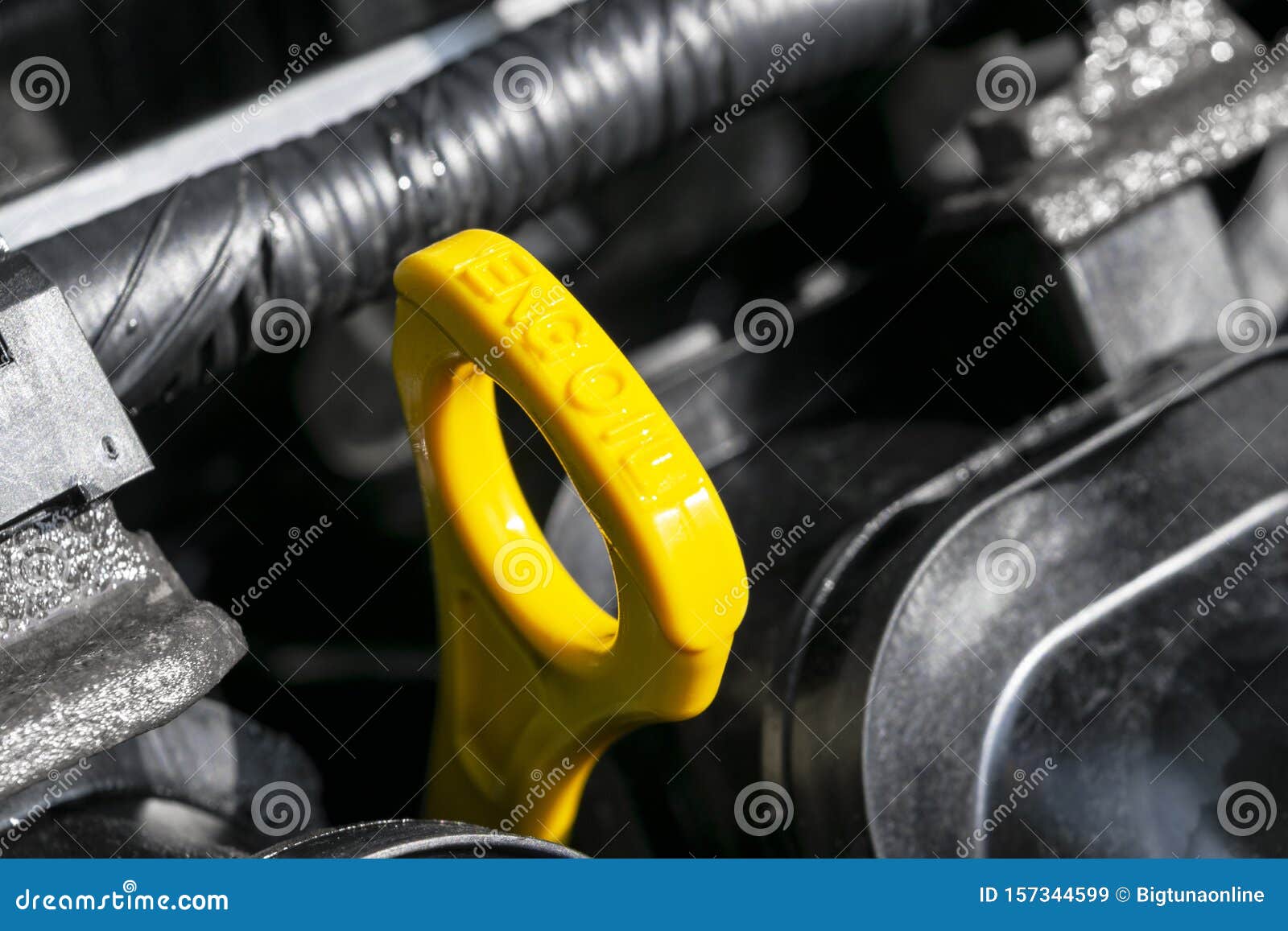 Yellow Oil Dipstick In Car Engine Measuring Level Of Engine Oil Yellow Oil Dipstick In Car Engine Measuring Level Of Engine Oil