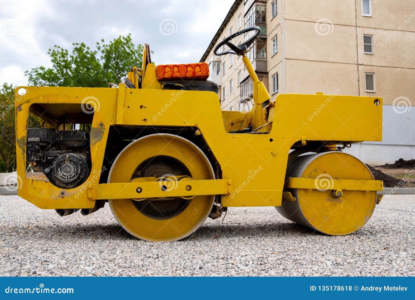 Yellow Old Road Roller in the Yard of the House Make Sidewalks Stock
