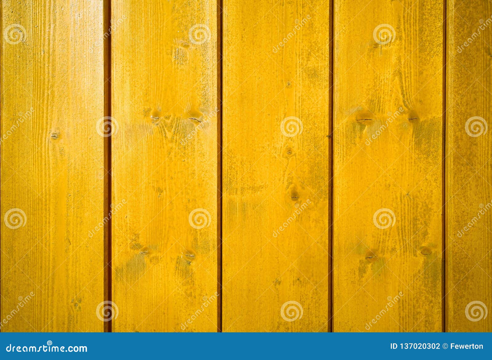 yellow orange painted wooden wall plank perpendicular to the frame as simple saturated intense yellow color wood background