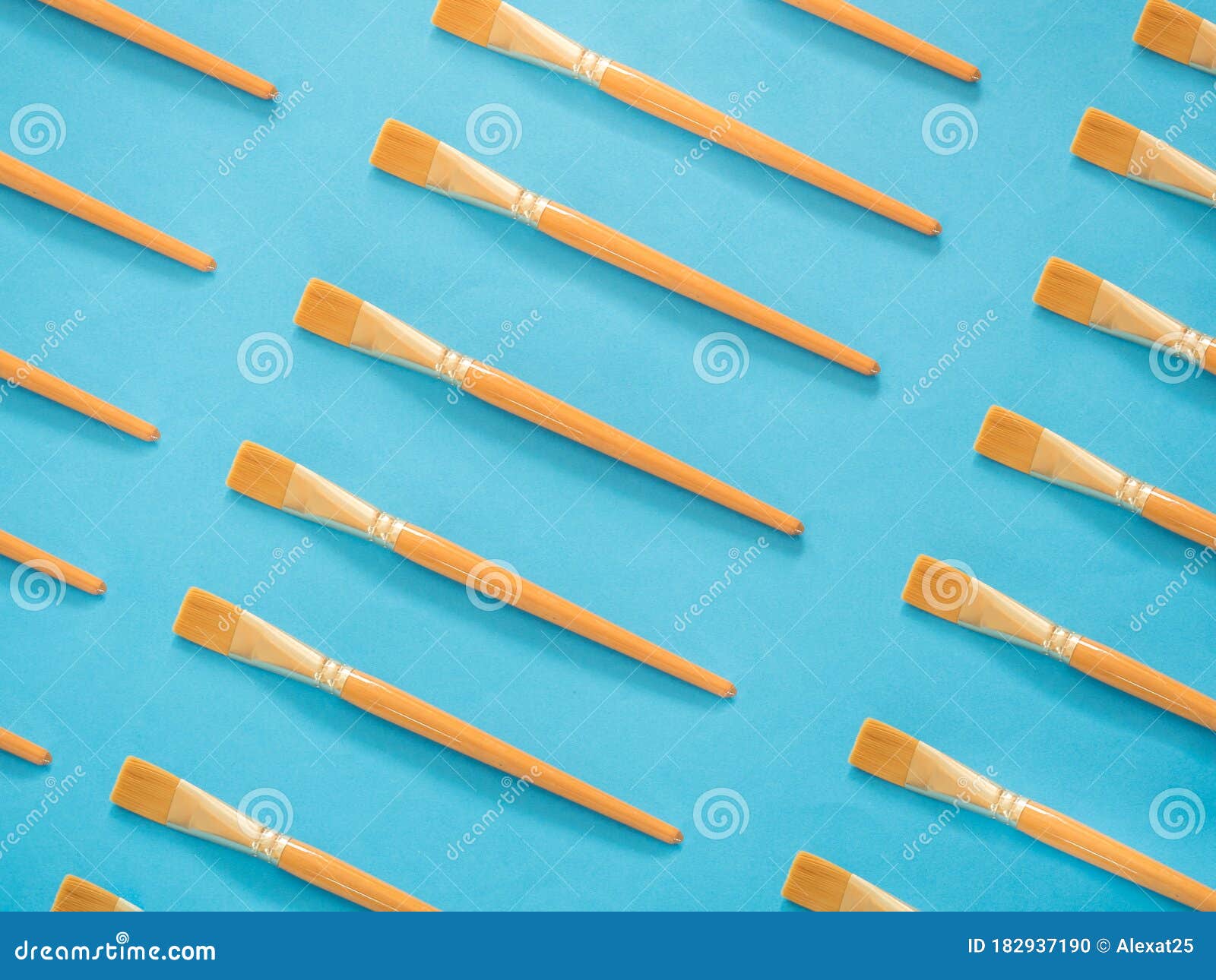 Yellow Paintbrushes Pattern on Blue Stock Photo - Image of object