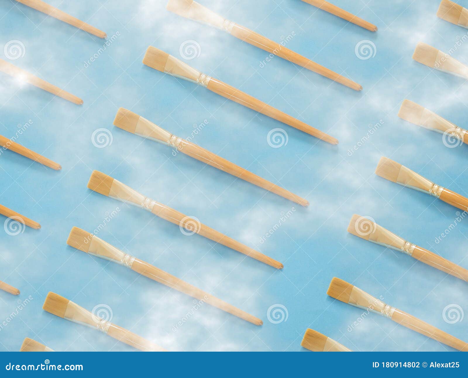 Yellow Paintbrushes Pattern on Blue with Clouds Stock Photo - Image of