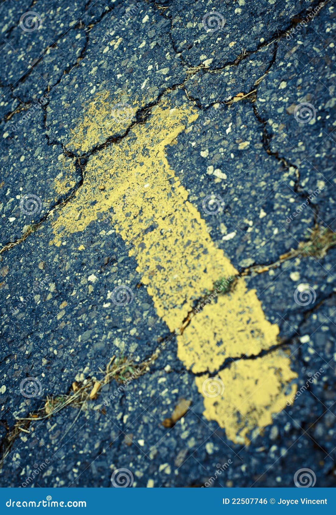 Yellow Painted Arrow on Cracked Pavement Stock Photo Image of