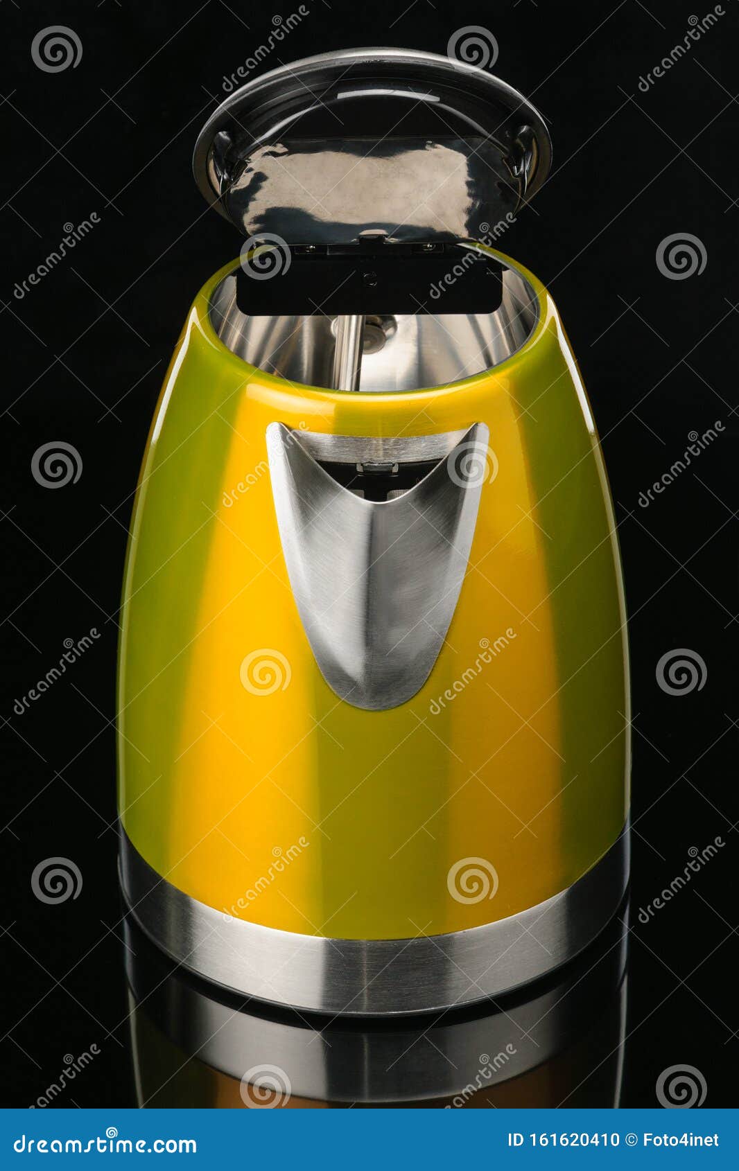 Yellow Stainless Steel Kettle on Black Mirror Background Stock Photo