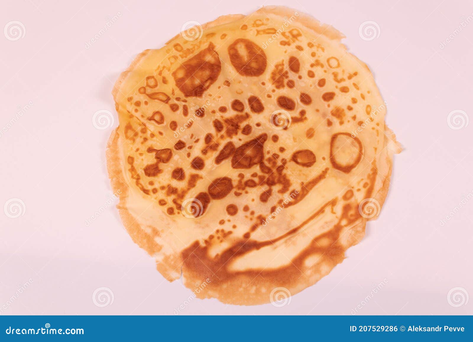 Yellow Pancake with Spots on the Reverse Side Top View Stock Photo