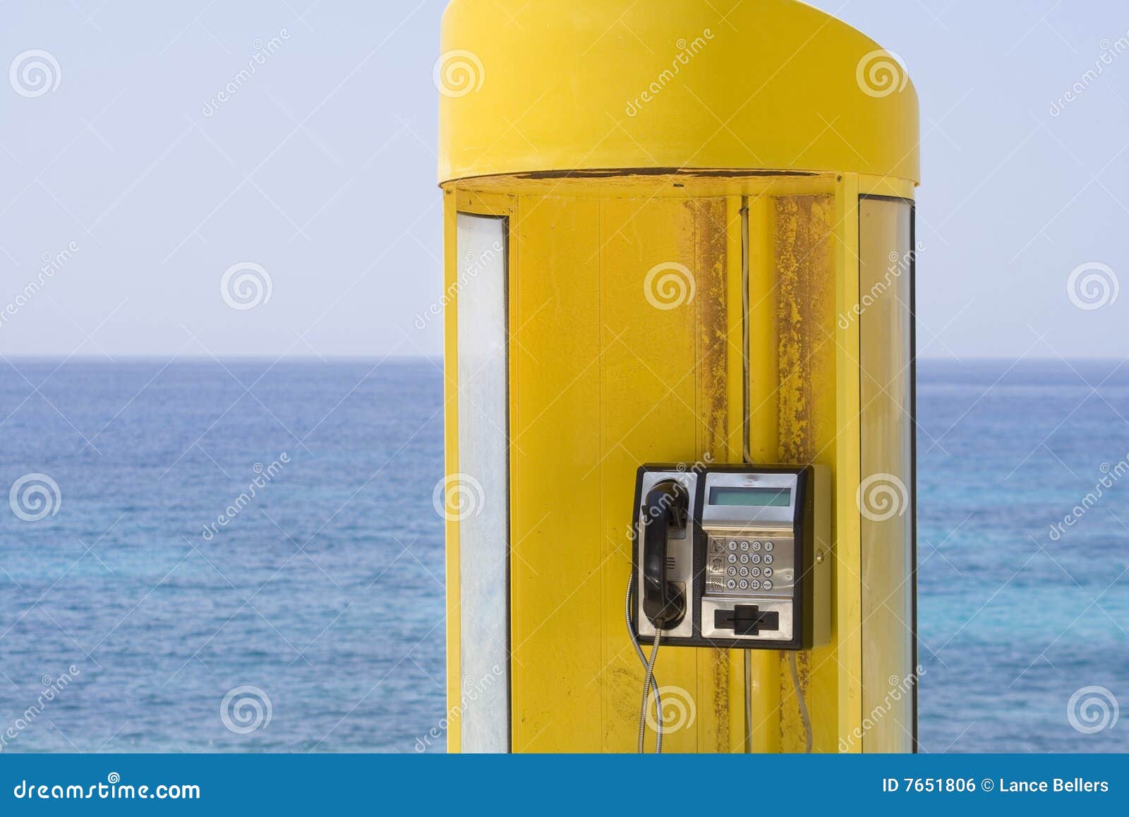 Yellow phone, blue sea stock photo. Image of kefalonia 7651806