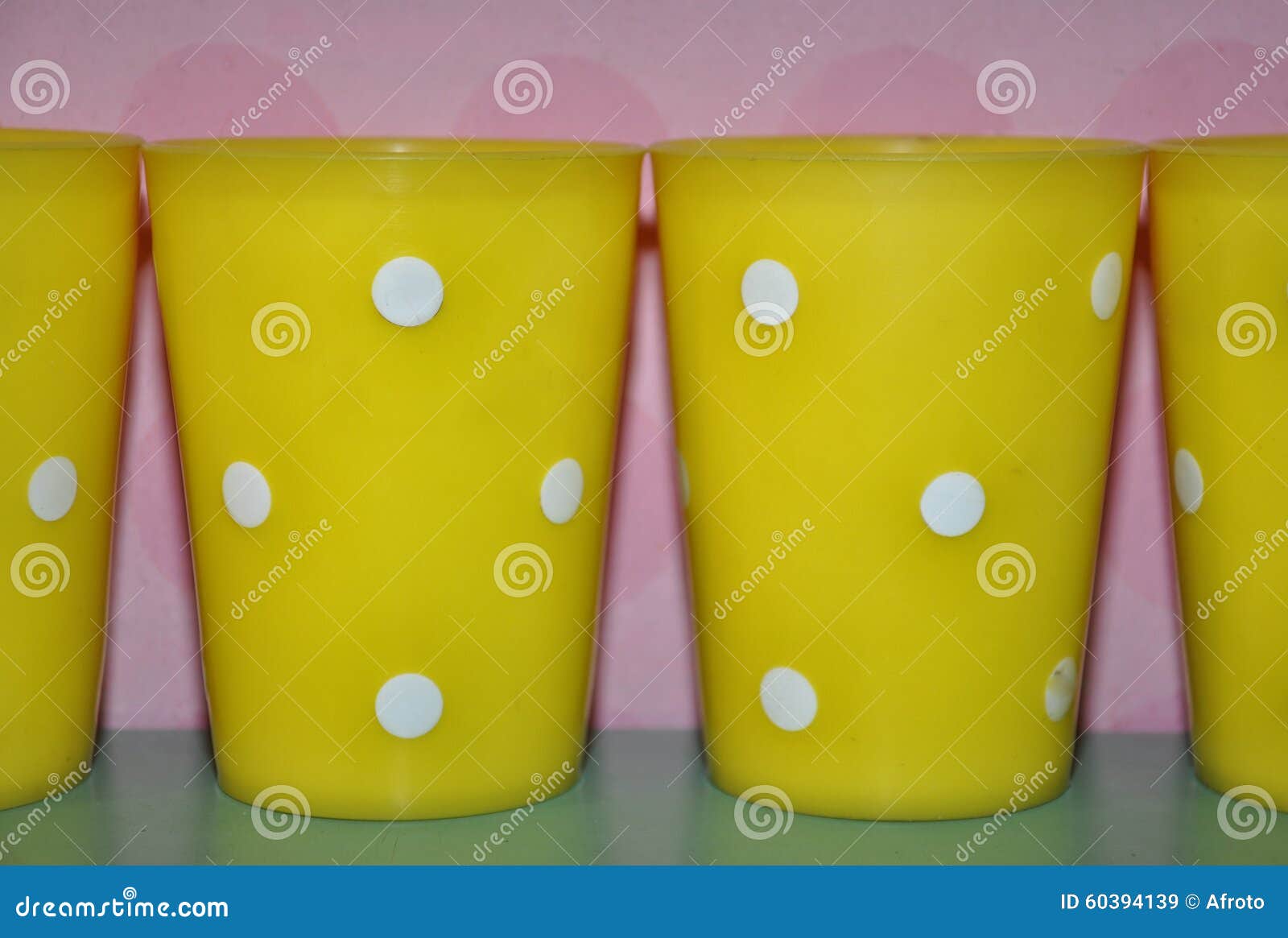 Yellow plastic cups stock image. Image of cheerful, cups 60394139