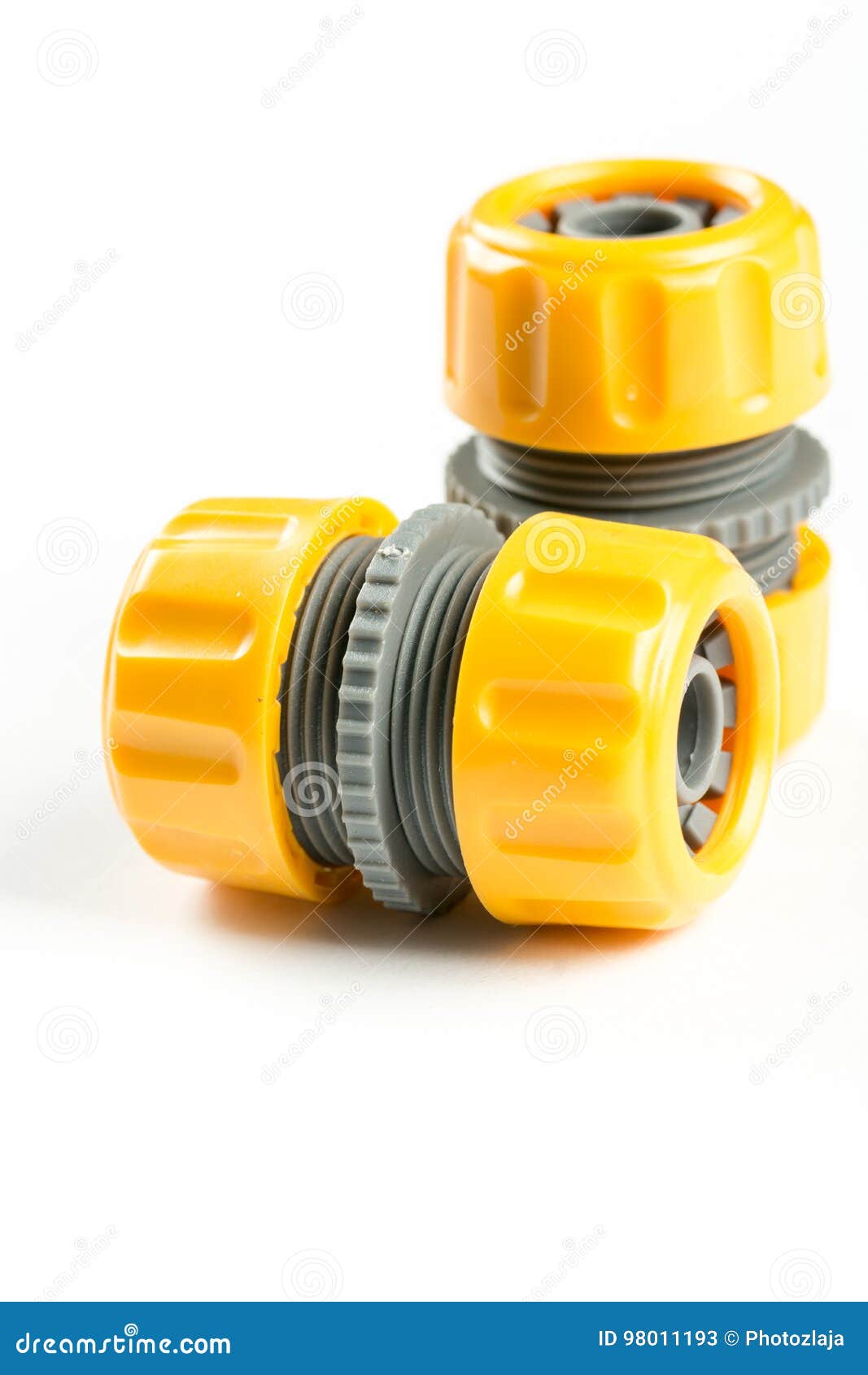 Yellow Plastic Irrigation Hose Connectors Over White Background with