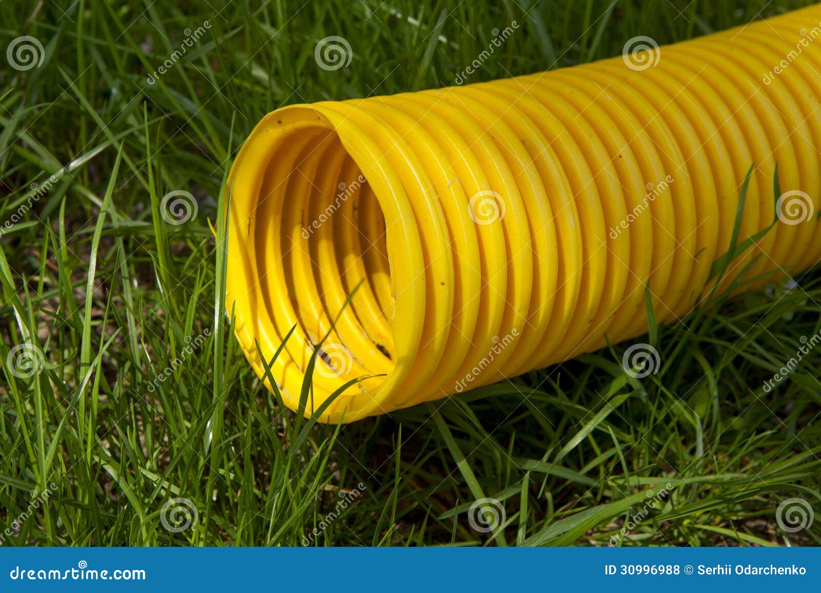 Yellow Plastic Pipe on Green Grass Stock Photo Image of outdoor