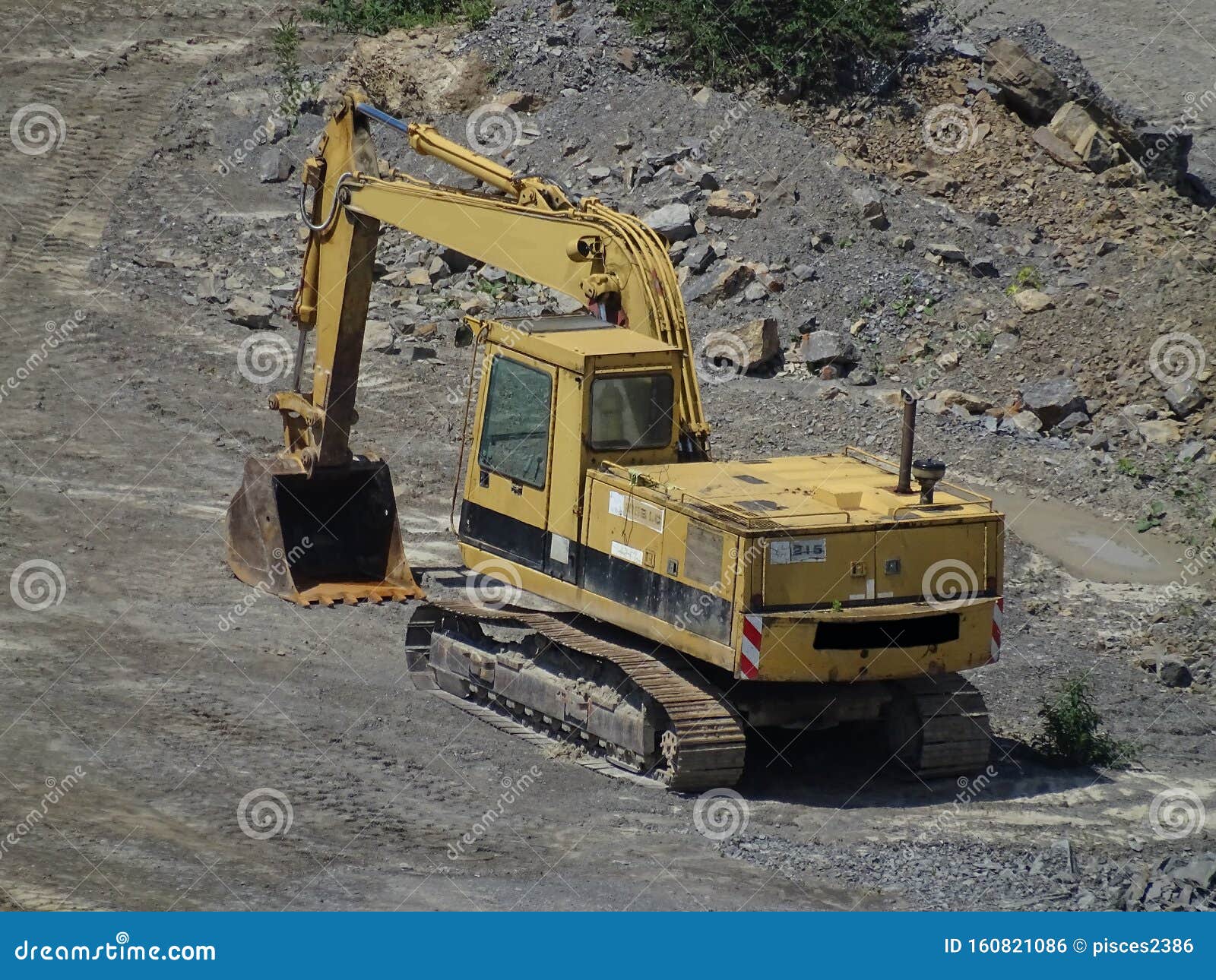 Yellow Power Shovel in the Dirt Spotted in Quarry Stock Photo Image