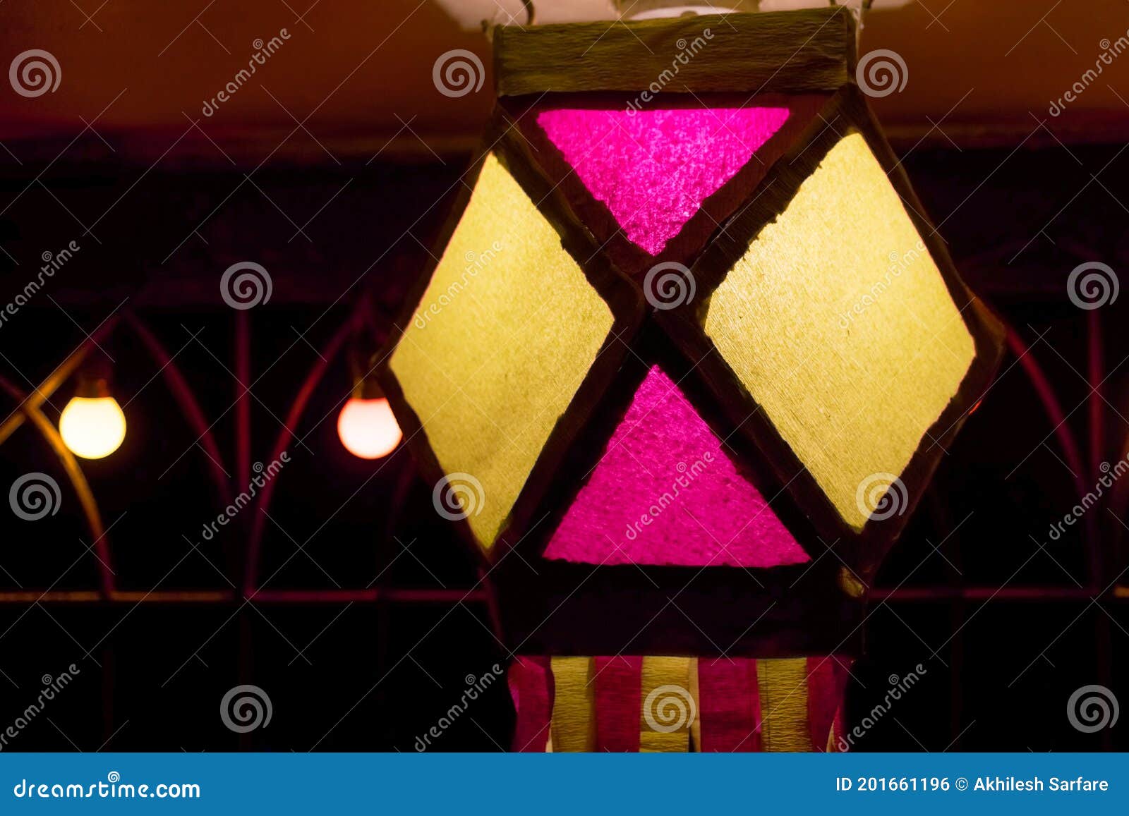 colorful diwali lantern or lamp hanging with bulbs in the background