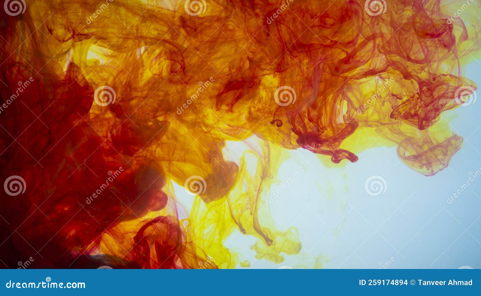 Yellow and Red Paint Making Abstract Art Wallpaper in White Stock Photo