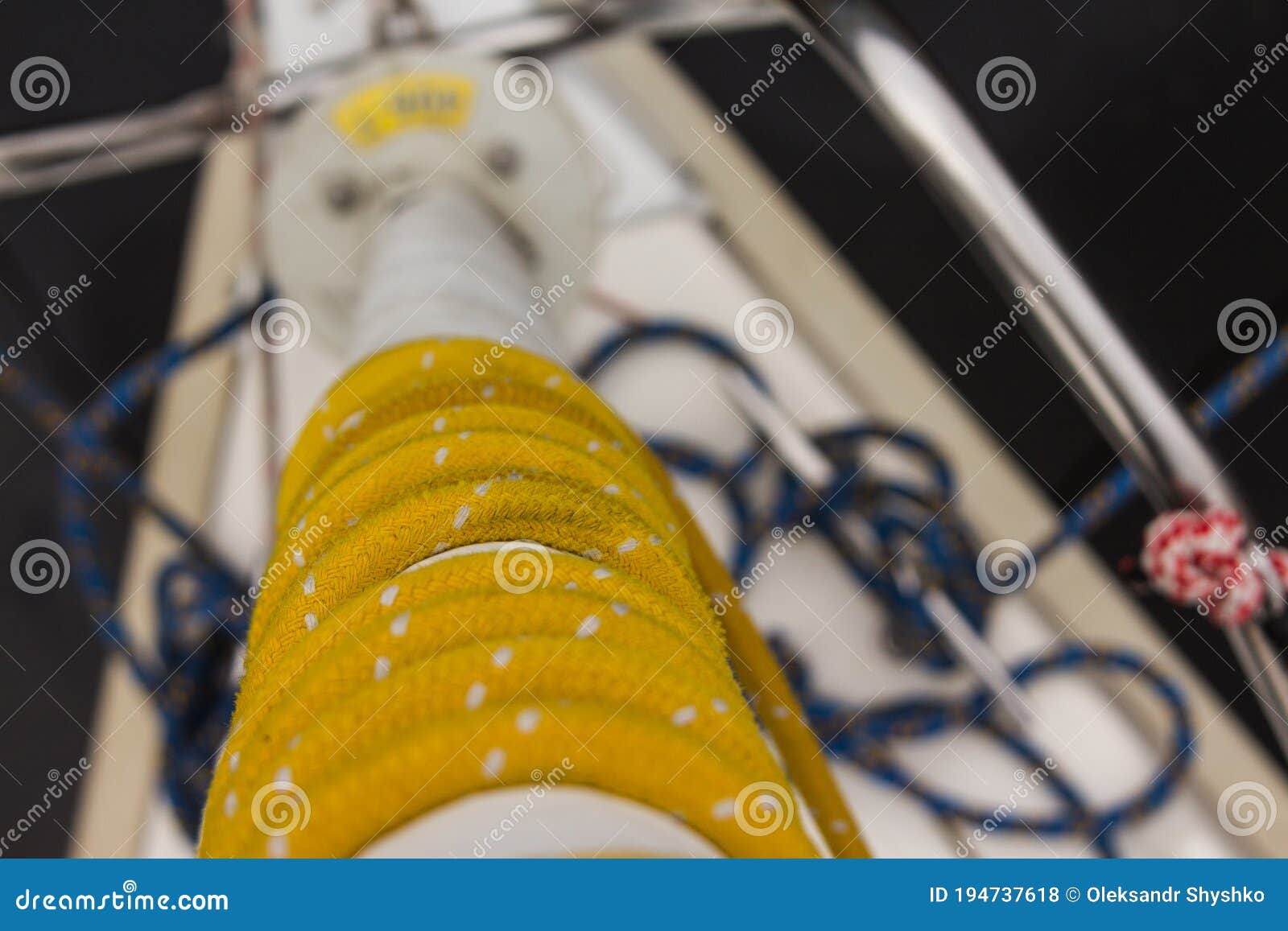 The Yellow Rope is Wound on a Jib on a Sailing Yacht Stock Photo