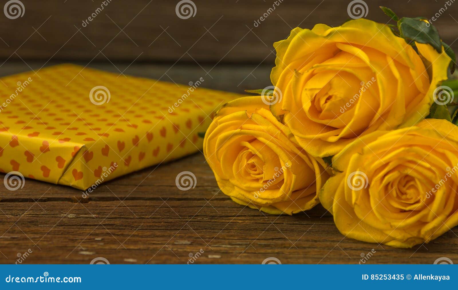Yellow Roses and Gift Box on a Old Wooden Table Stock Image Image of