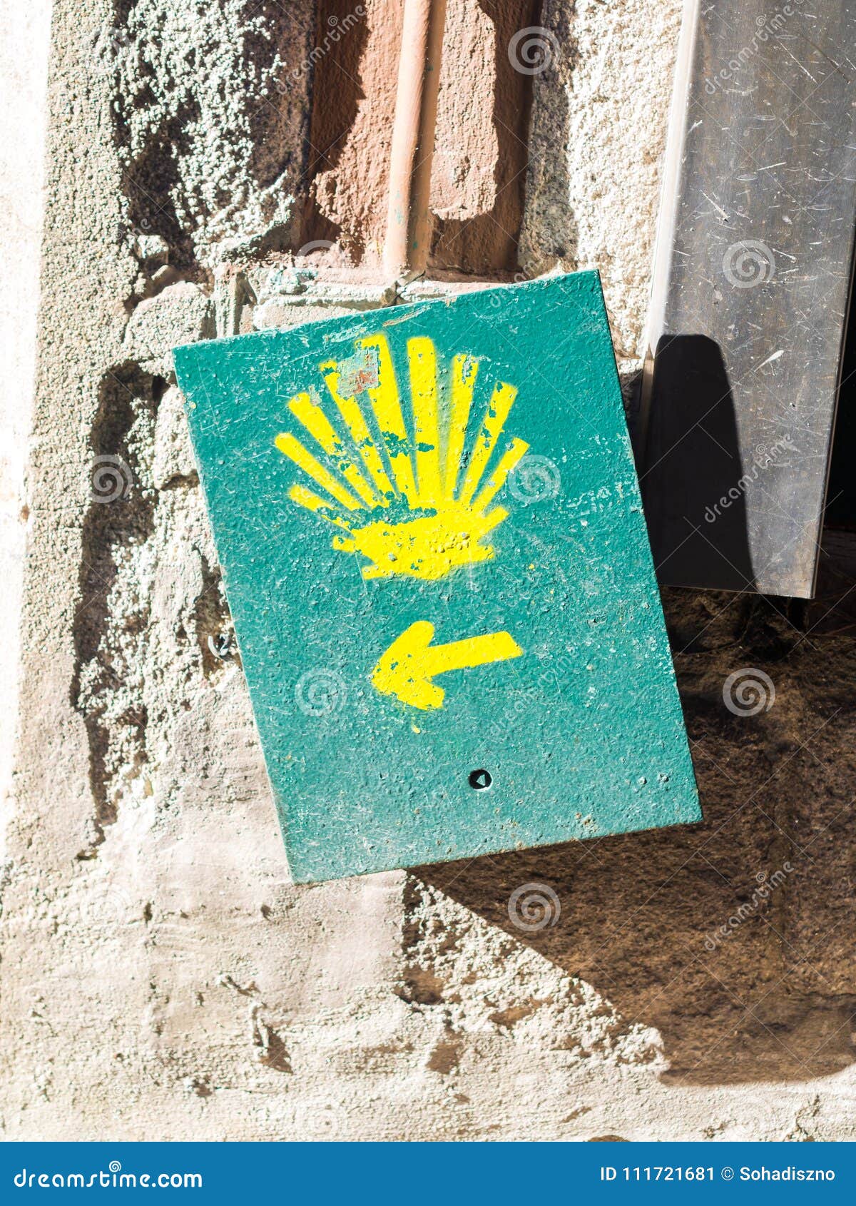 the yellow scallop shell signing the way to santiago de compostela in porto, on the saint james pilgrimage route