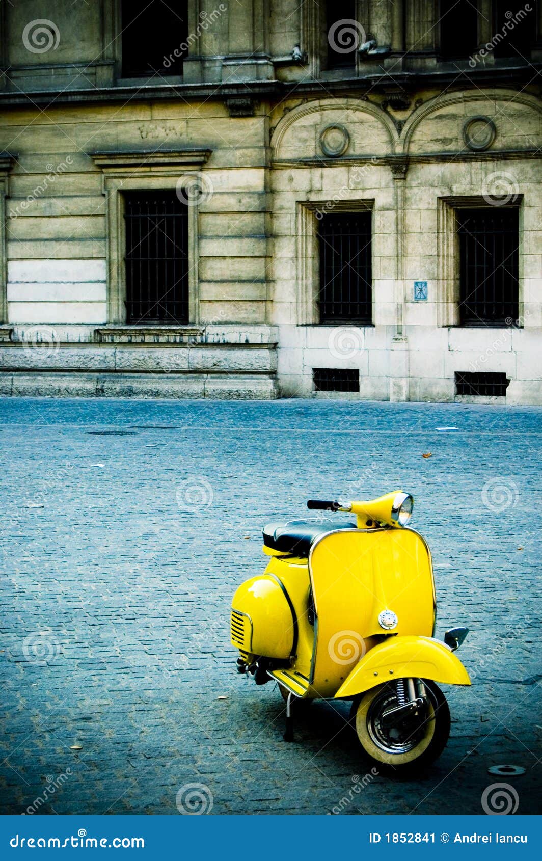 yellow scooter in plaza