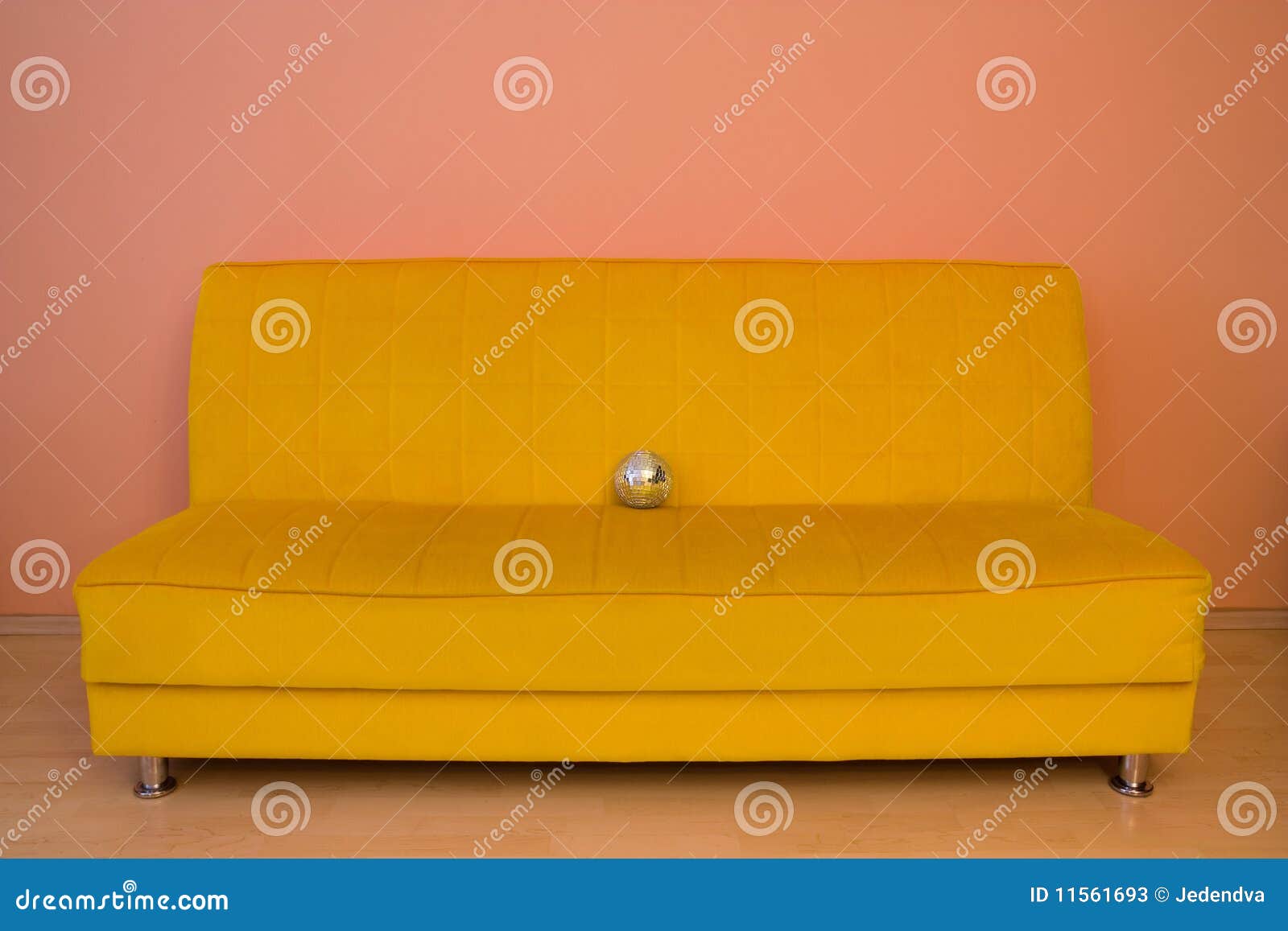 yellow sofa with small discoball