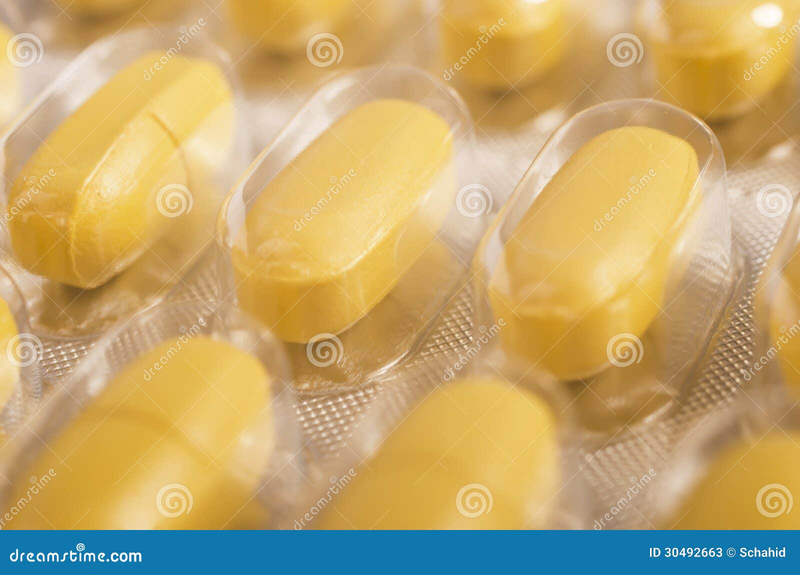 Yellow tablets closeup of stock image. Image of closeup 30492663