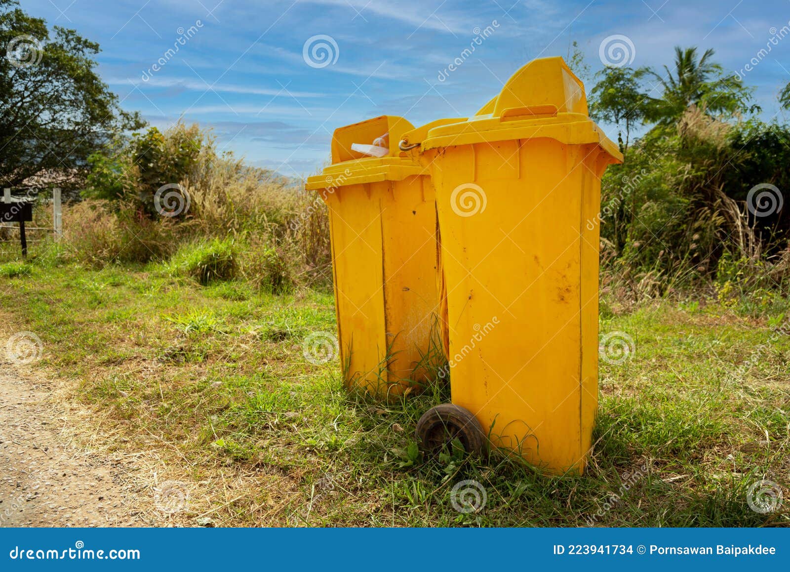 Yellow trash cans stock photo. Image of trash, street 223941734