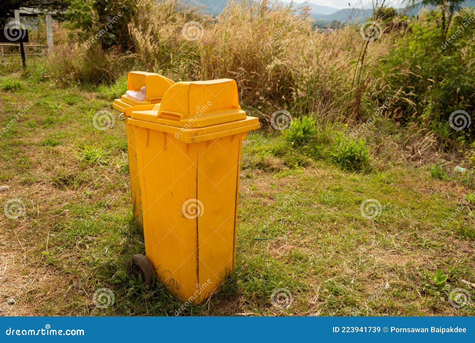 Yellow trash cans stock image. Image of park, concept 223941739