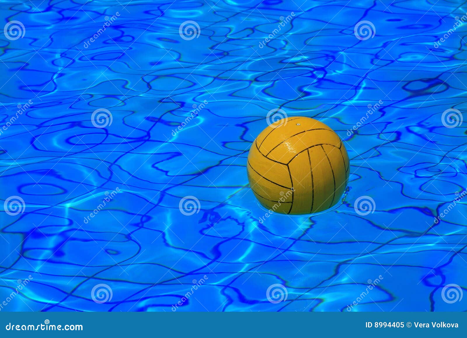 yellow water polo ball on water background