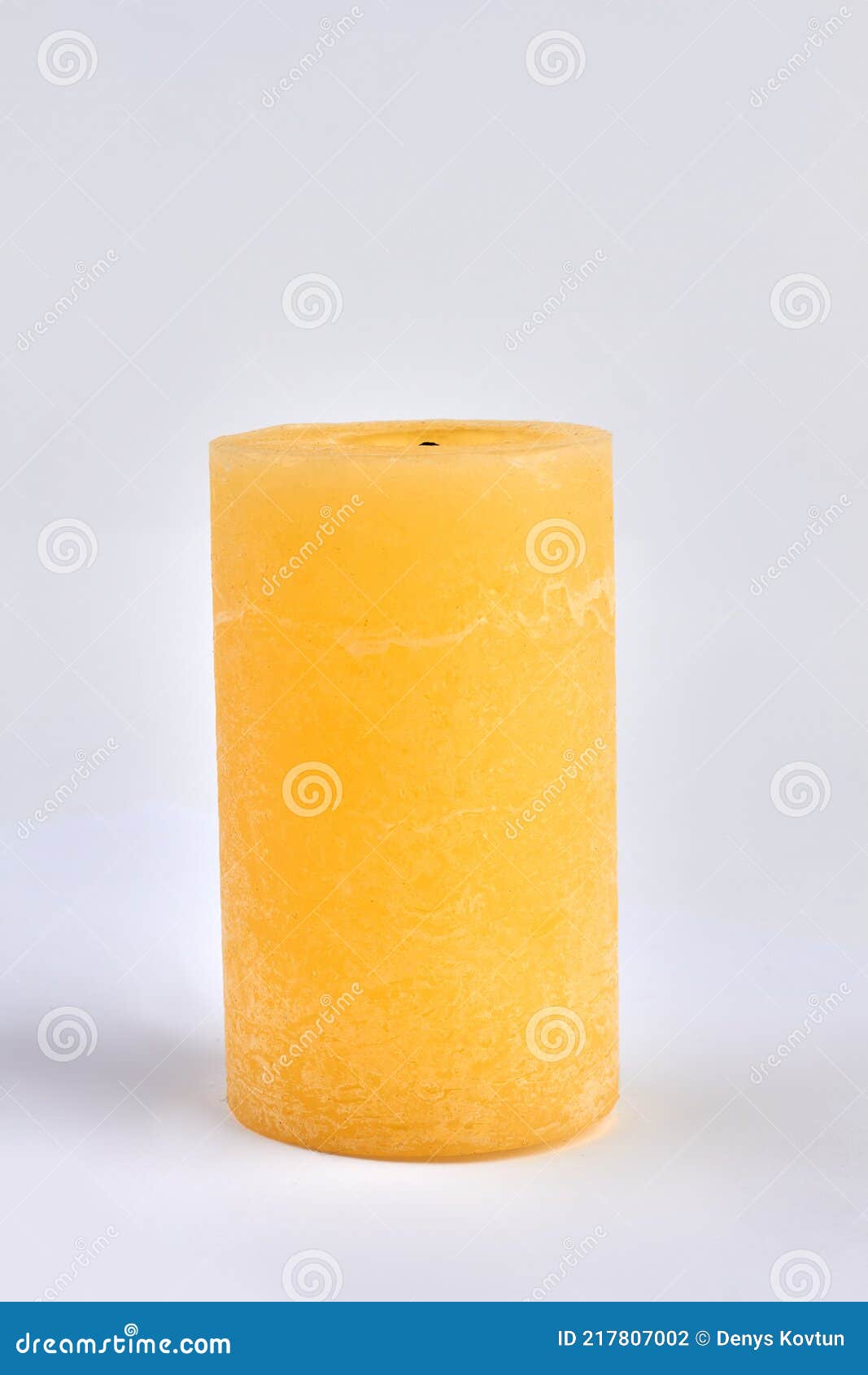 Yellow Wax Candle on White Background. Decorative Candle. Stock Photo Image of candle, clean