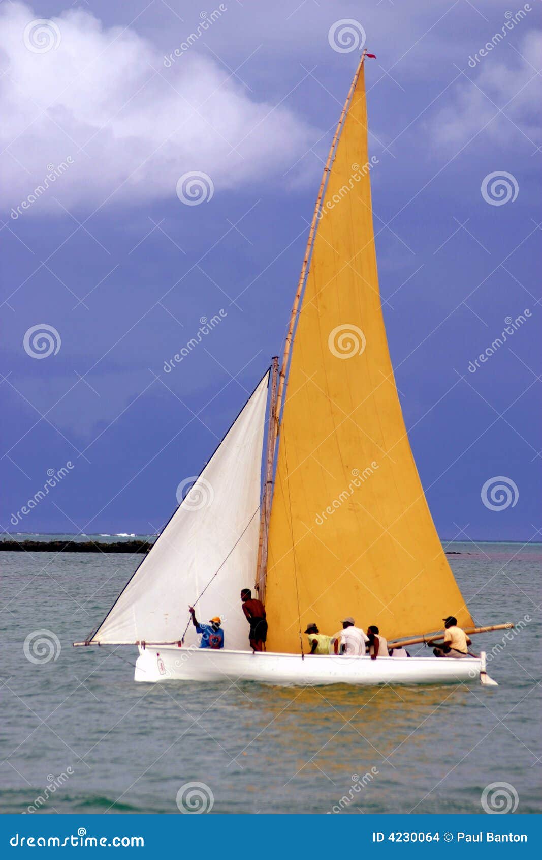 yellow and white sailed pirogue