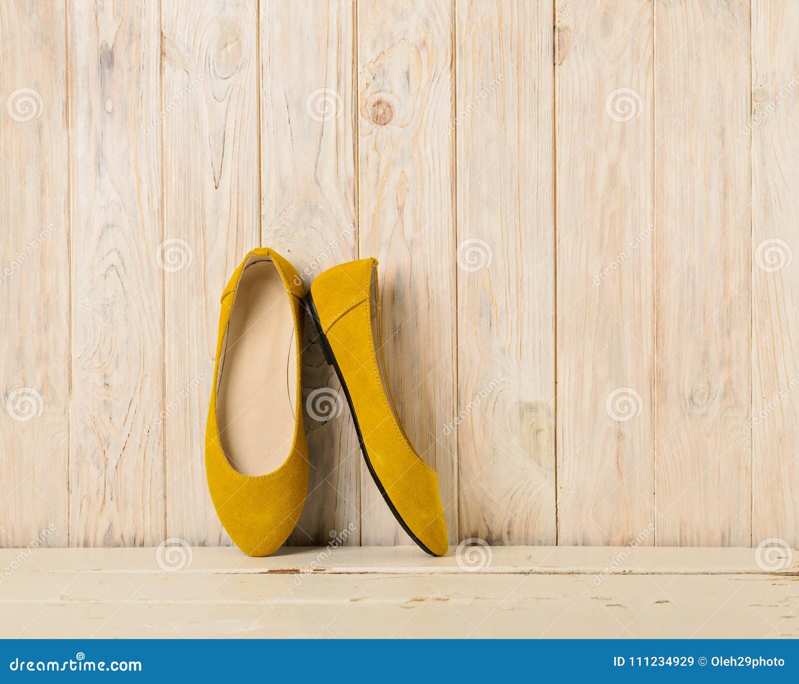 Yellow Women`s Shoes Ballerinas on Wooden Background. Stock Image ...