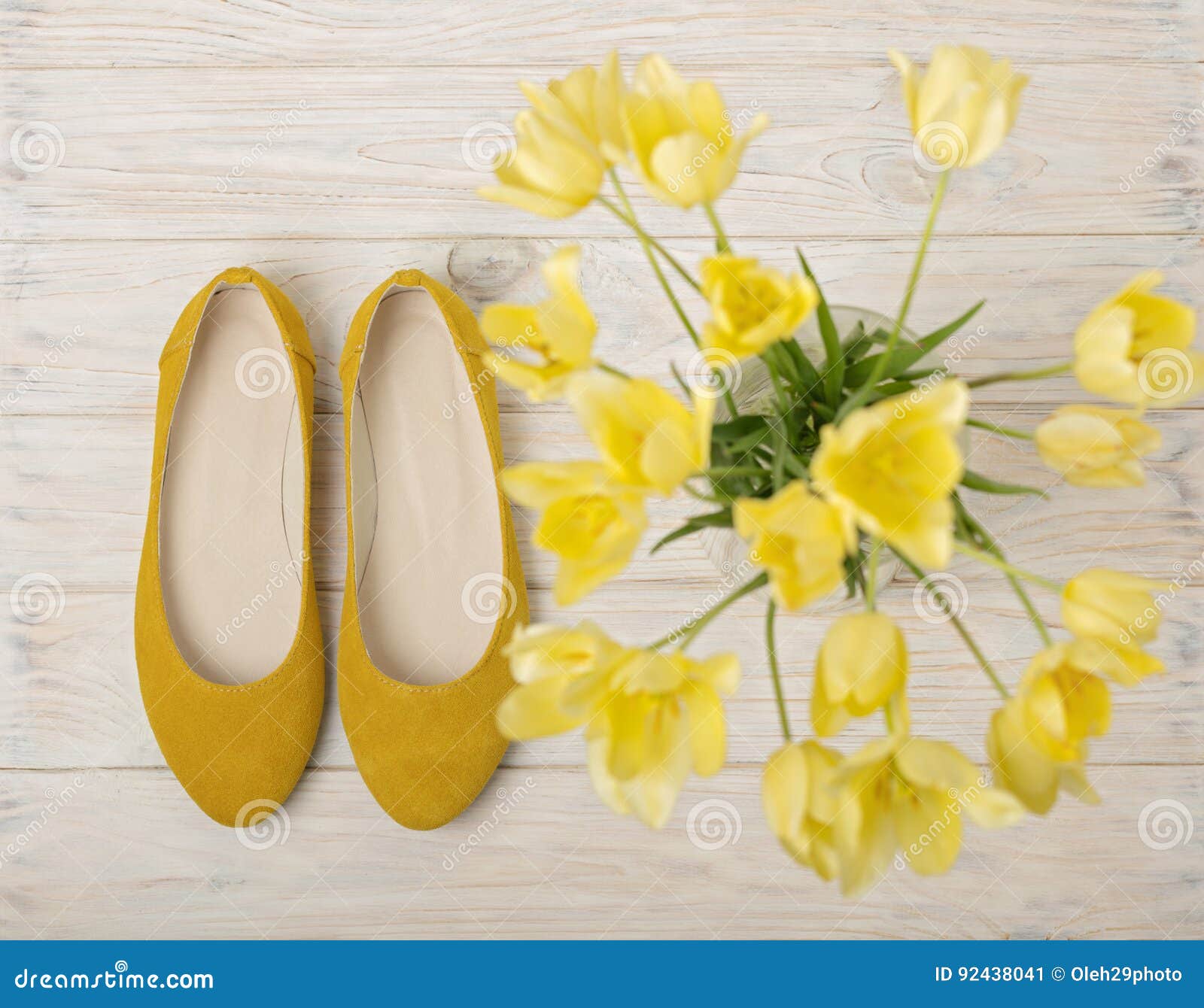 Yellow Women`s Shoes Flats and Yellow Tulips on a Light Wooden Stock ...