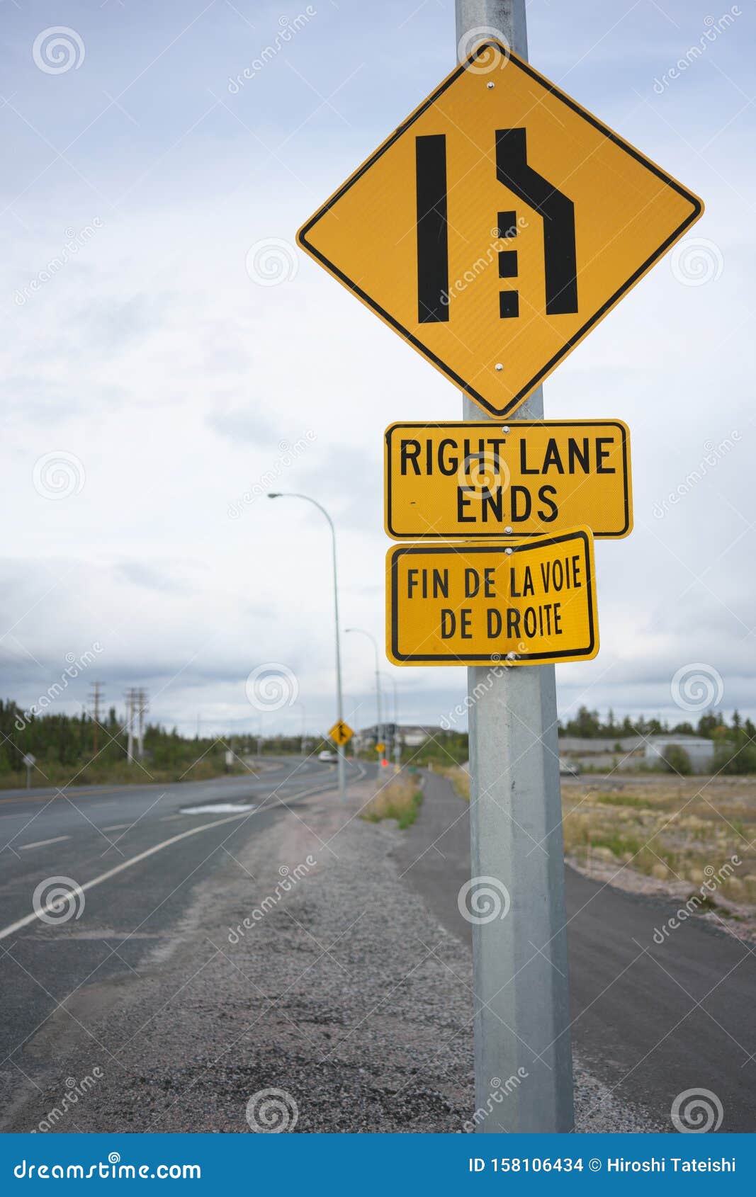 yellowknife-canada-september-right-lane-ends-sign-along-th-street-158106434.jpg