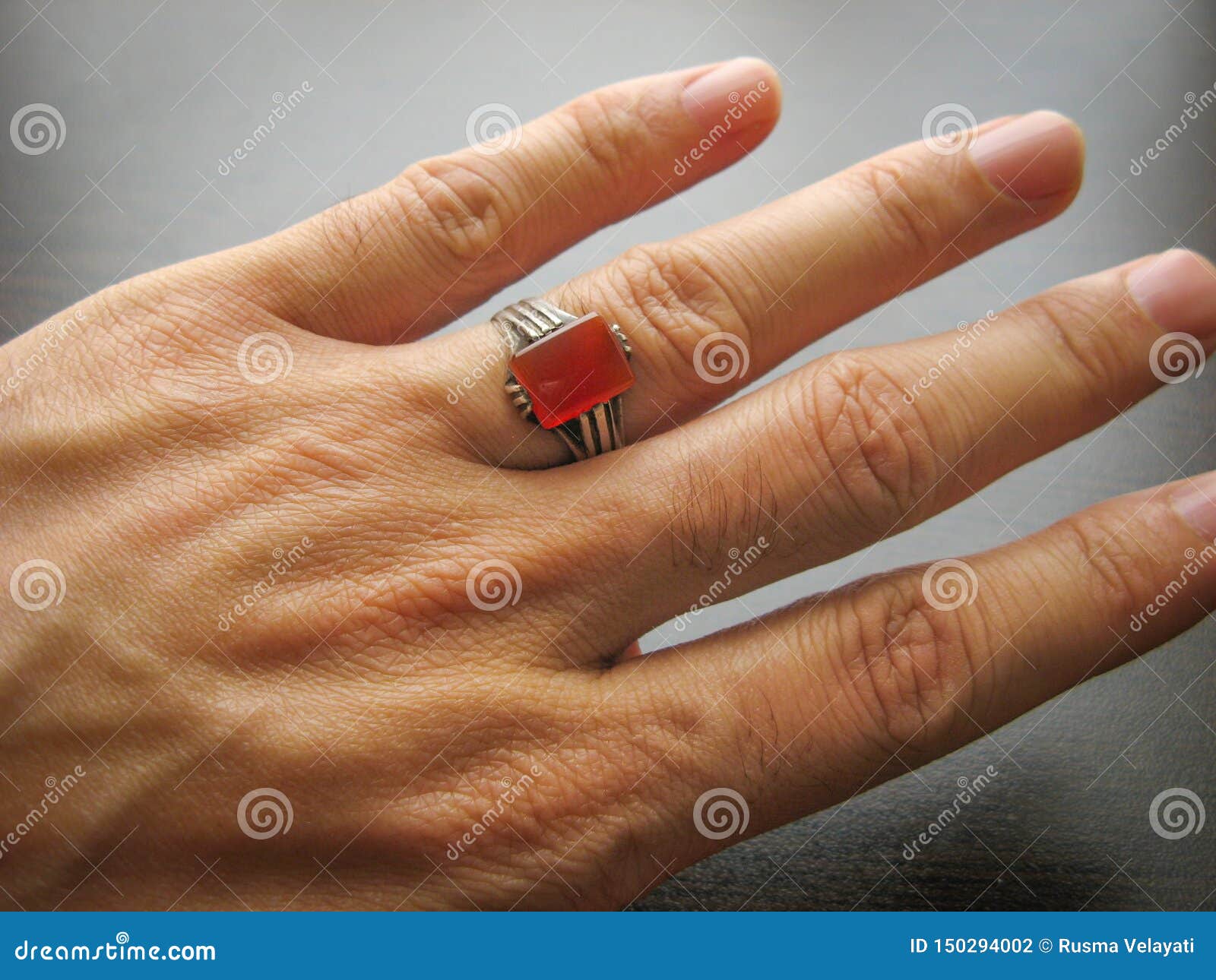 yemeni red aqeeq agate stone male hand ring ring finger dark background yemen ring yemeni red aqeeq agate stone male 150294002