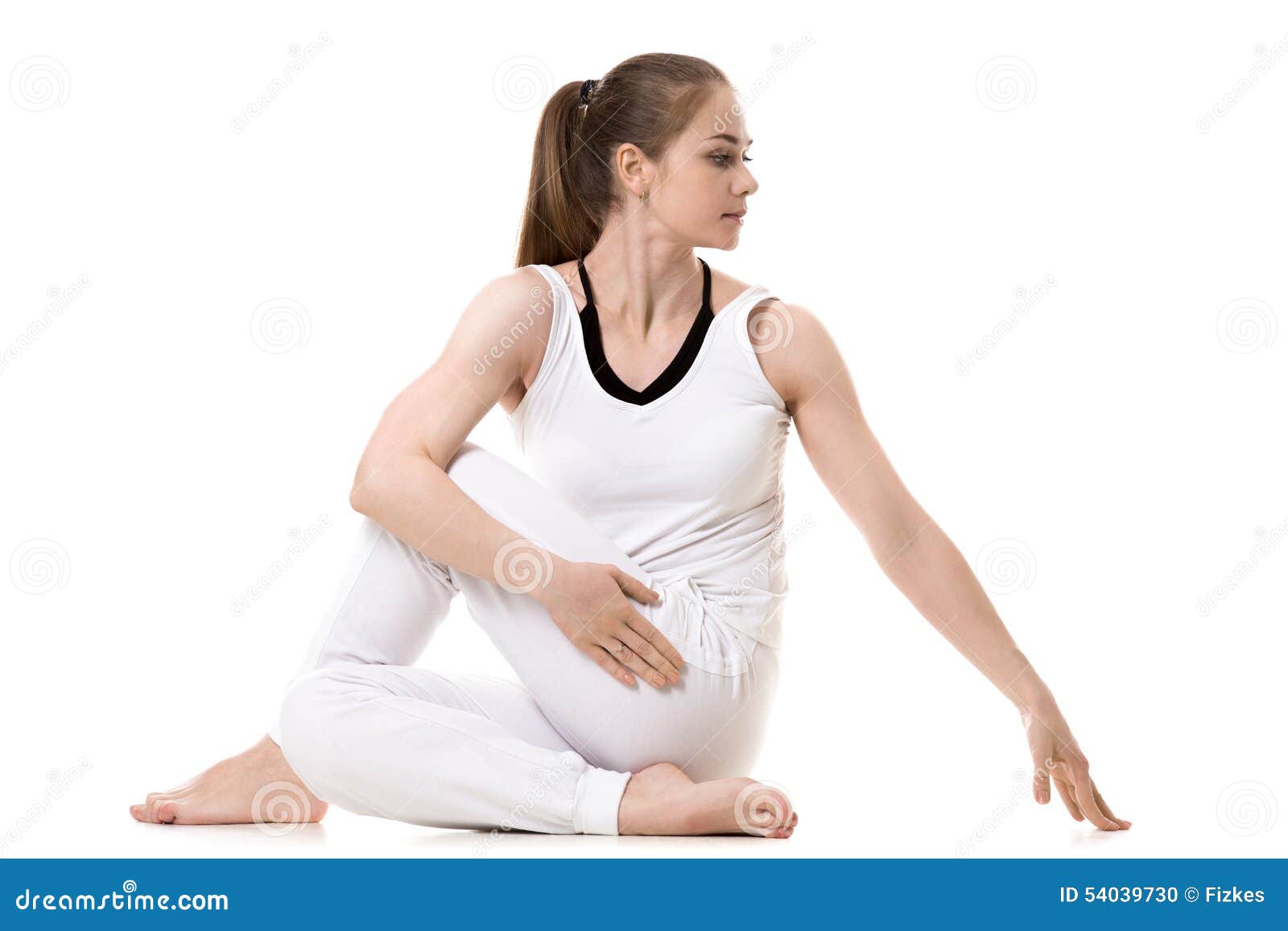 Half Lord of the Fishes Pose or Ardha Matsyendrasana performed by a  caucasian young man on the colorful mat by wearing black attire Stock Photo  - Alamy