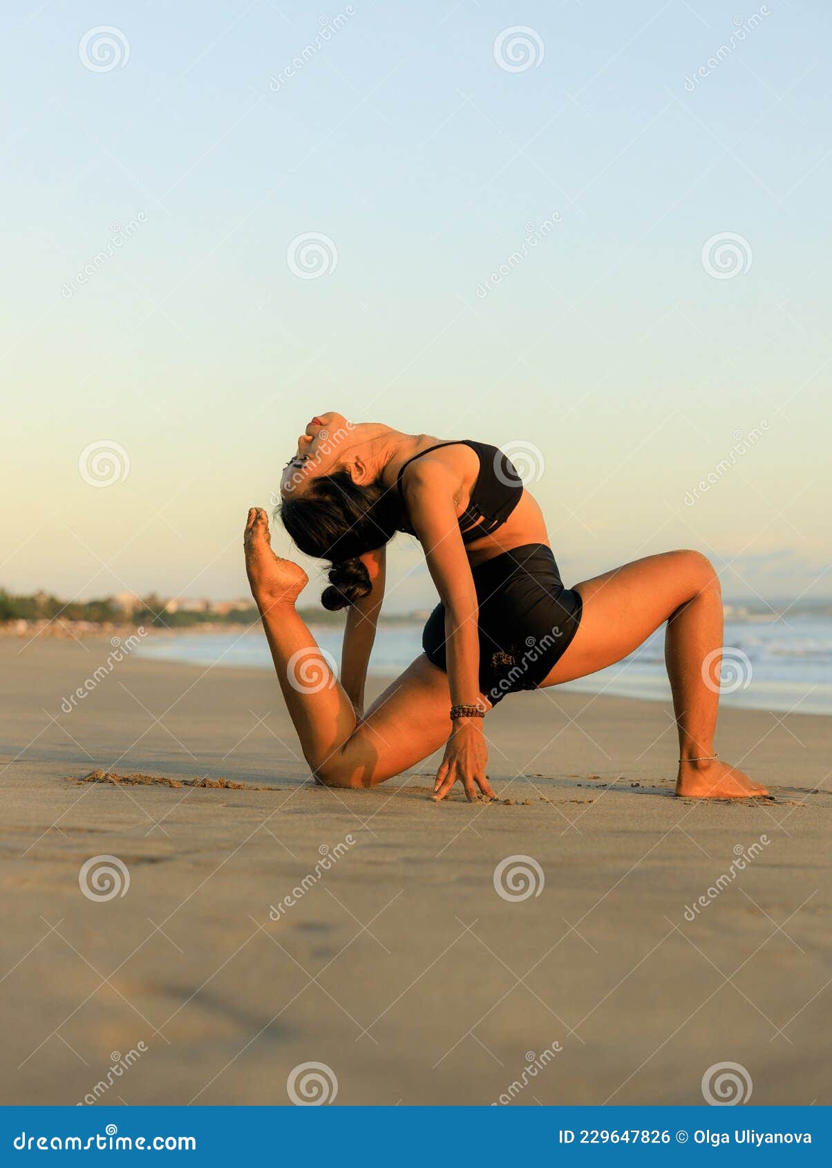 Yoga on the Beach. Variation of Low Lunge Pose, Anjaneyasana