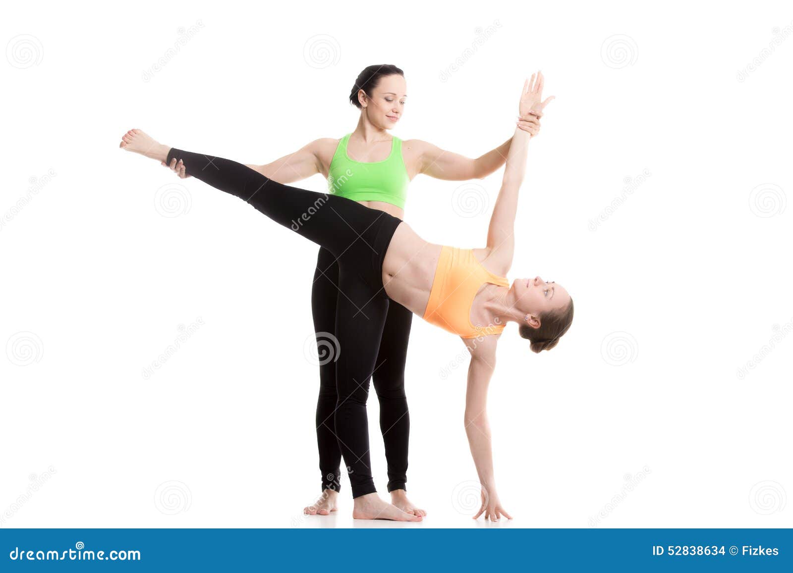Women do partner yoga make Double Plank pose near sea Stock Photo by  ©amoklv 307502276