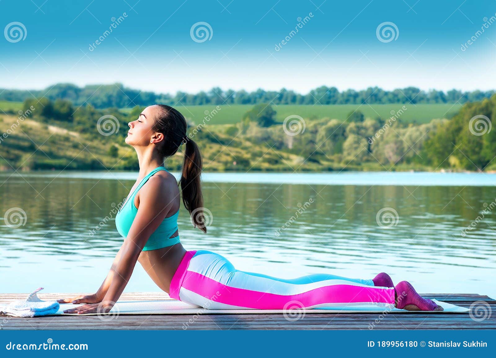 yoga. cobra pose.beautiful girl in the pose of a cobra is engaged in yoga on the background of beautiful nature.healthy lifestyle