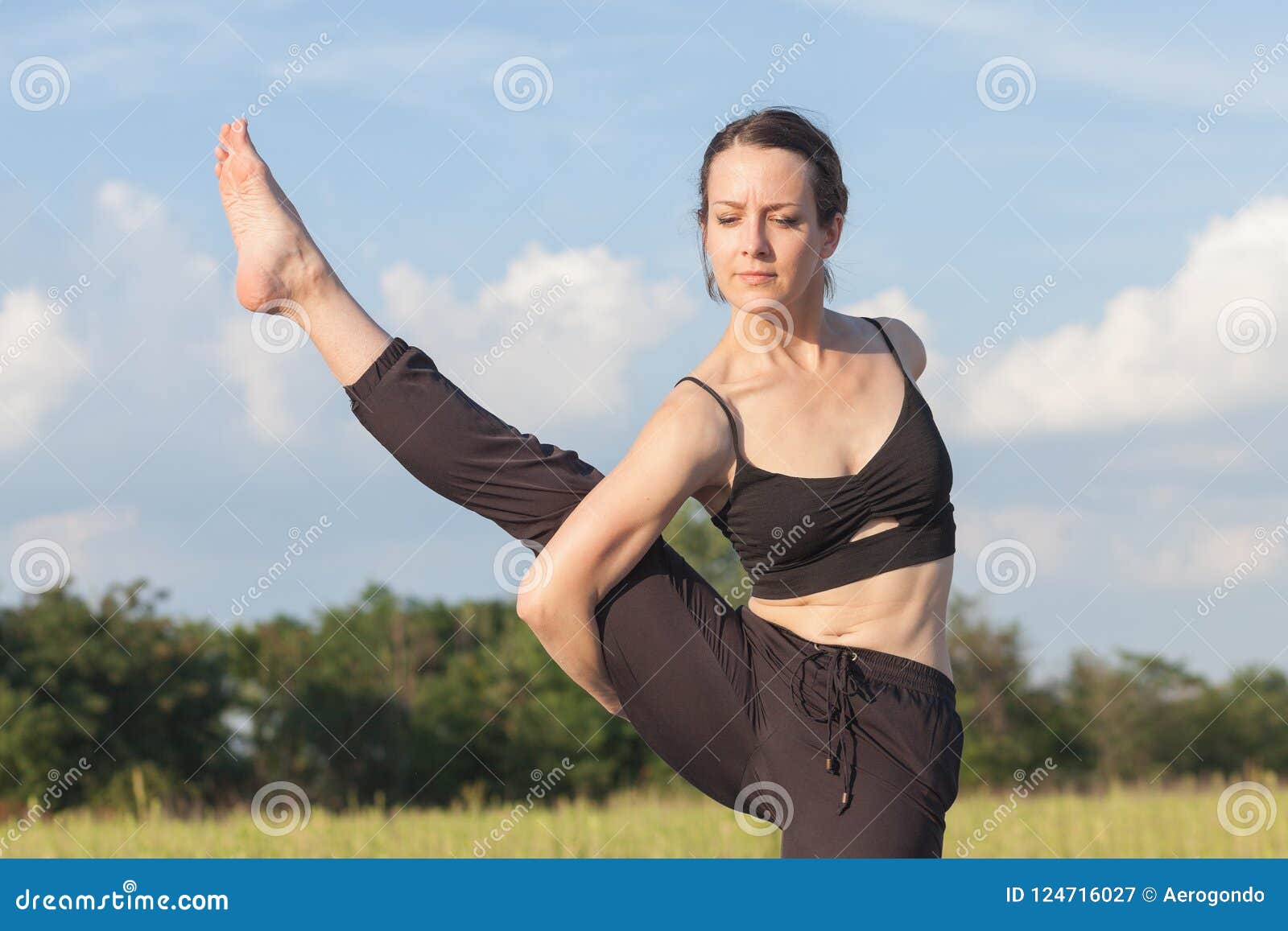 Yoga Guru Performing a Flexibility Pose Stock Image Image of blue