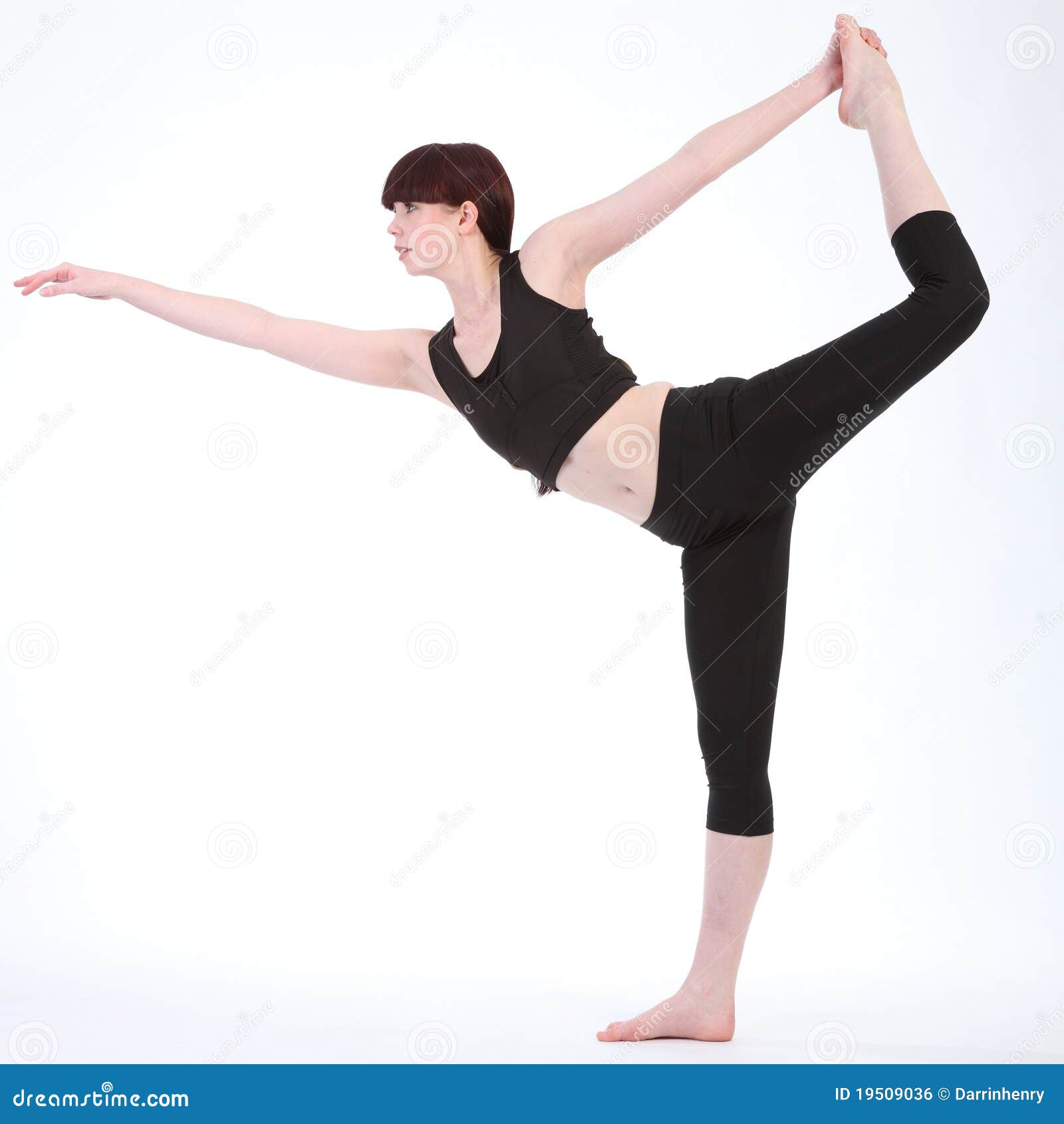 Yoga is a great workout. Shot of a young woman doing the king dancer pose  while practicing yoga at home. Stock Photo by ©PeopleImages.com 567795622