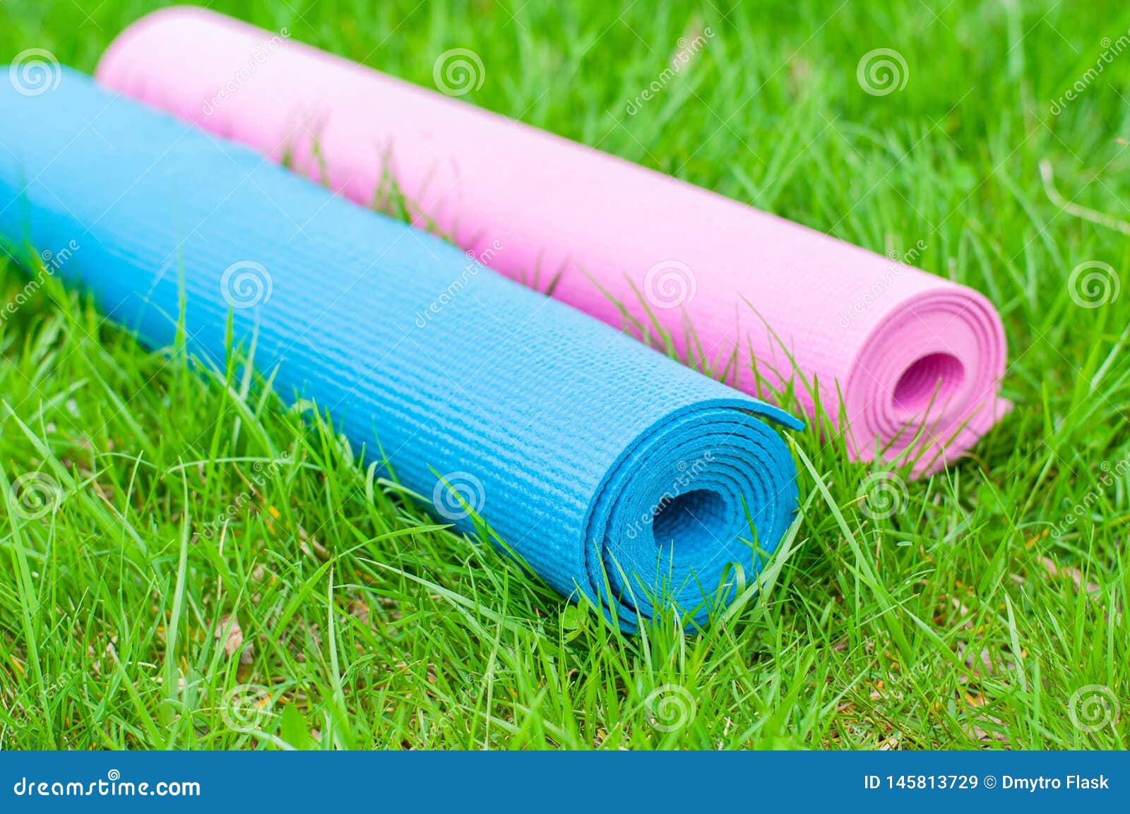 Yoga Mats On The Grass. Fitness Concept 
