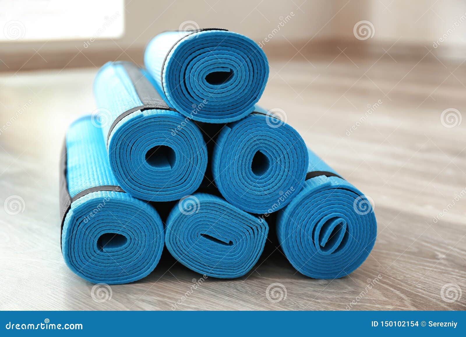 Yoga mats on wooden floor stock photo. Image of meditation 150102154